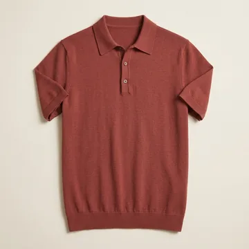 A rust knit polo laid flat, photographed from above